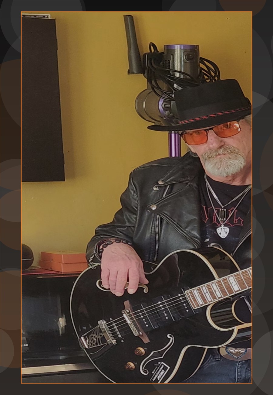 Johnny Phoenix holding a guitar